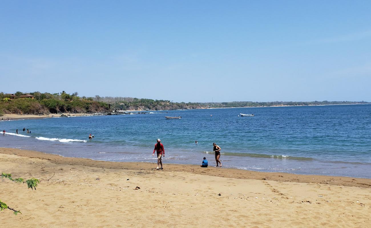 Фото Puerto Escondido Beach с светлый песок поверхностью