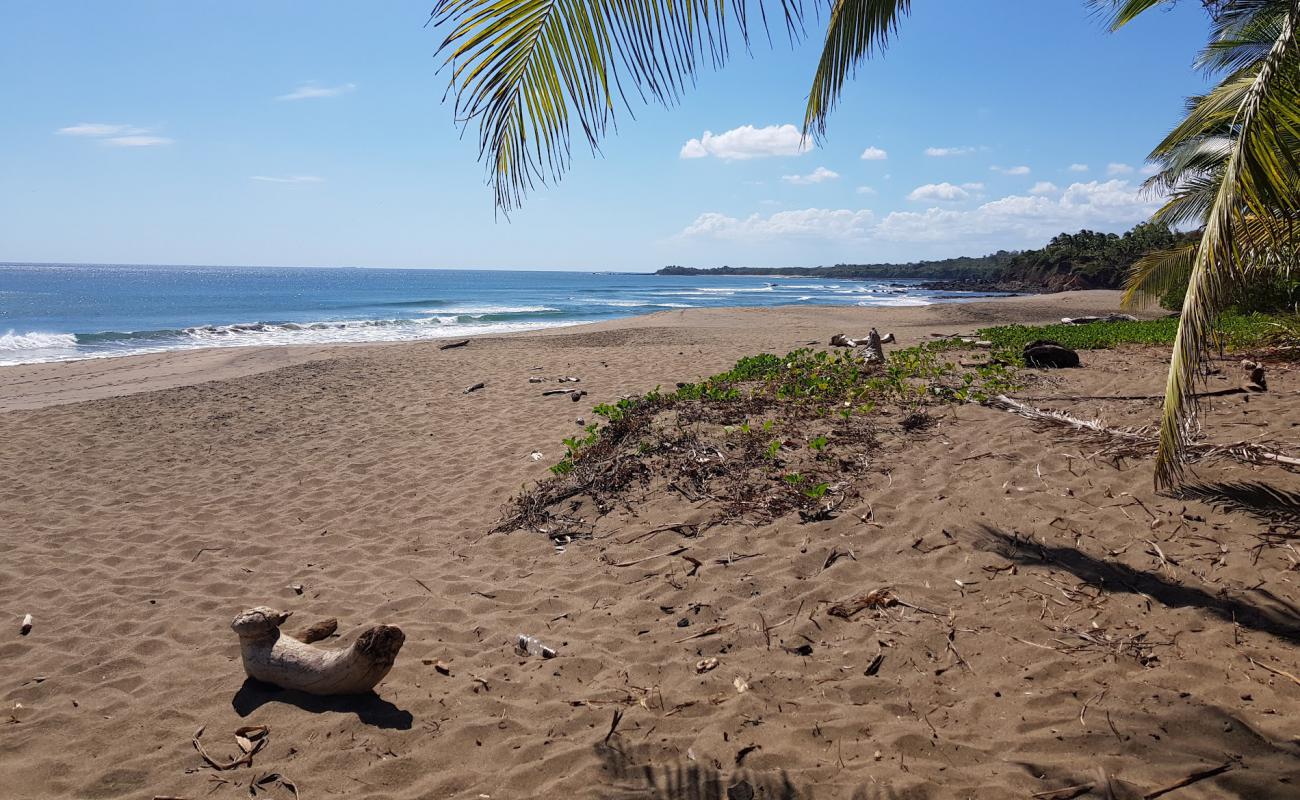 Фото Destiladeros Beach с темный песок поверхностью