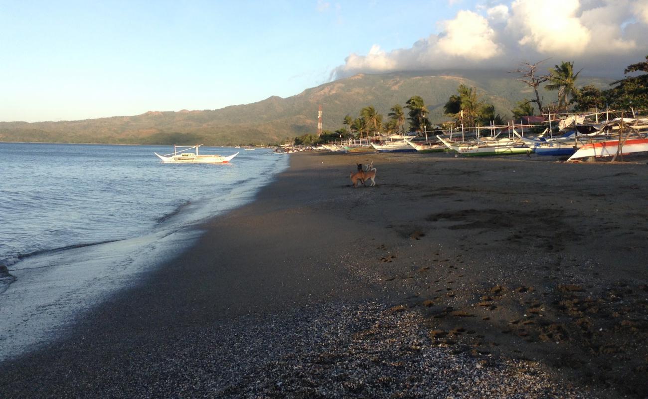 Фото Paluan Beach с песок с камнями поверхностью