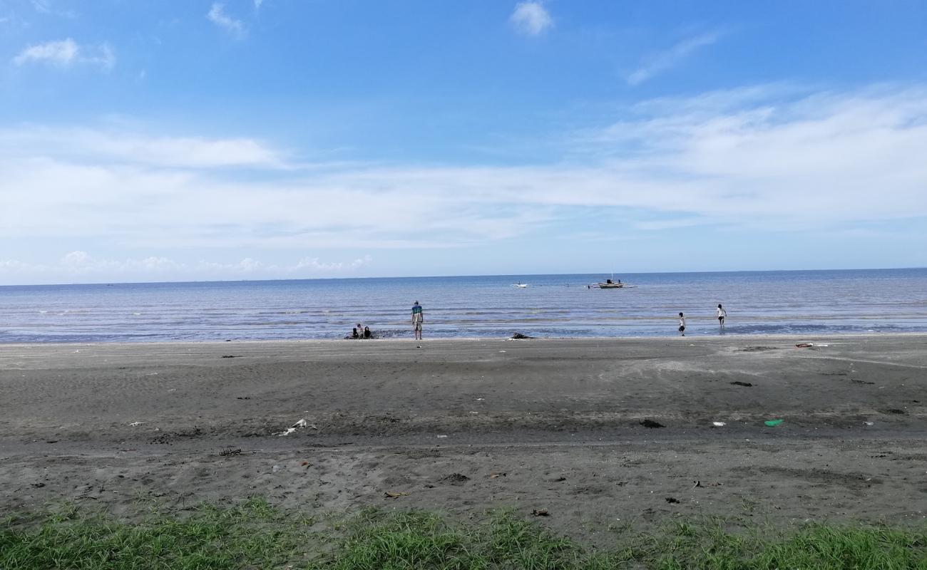 Фото San Enrique Bay Beach с серый песок поверхностью