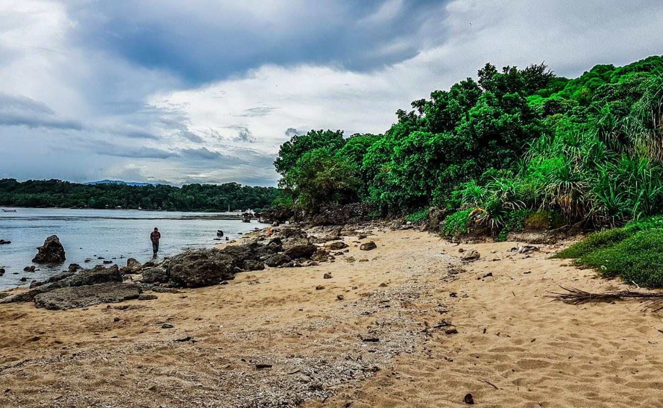 Фото Cliff beach Siaton с песок с камнями поверхностью