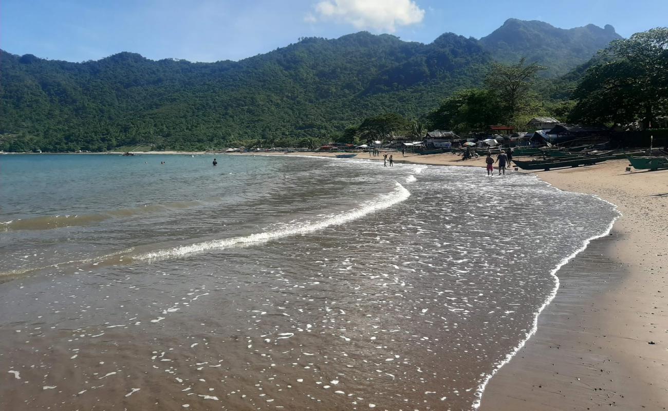 Фото Patungan beach с светлый песок поверхностью