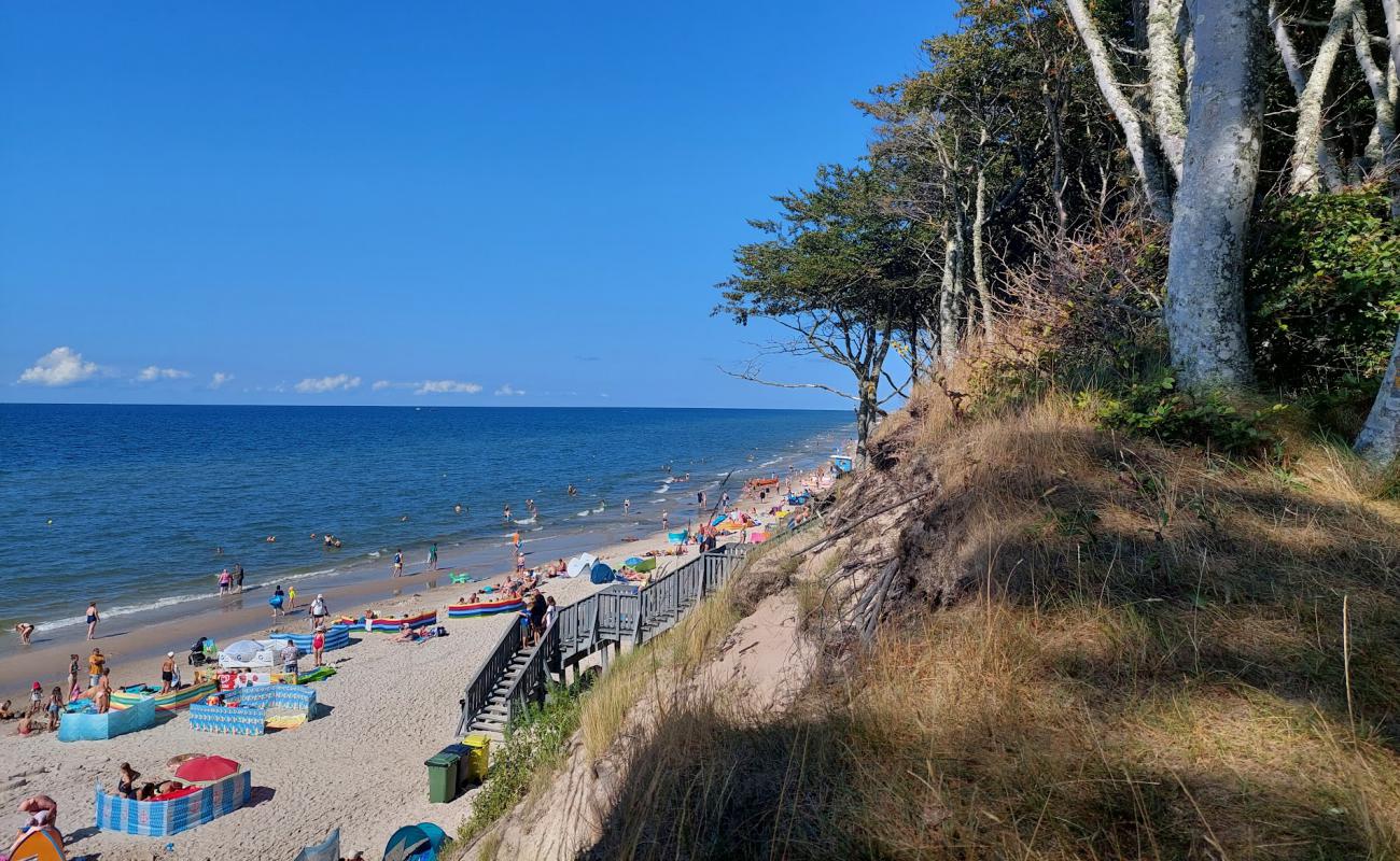 Фото Debina Beach с светлый песок поверхностью