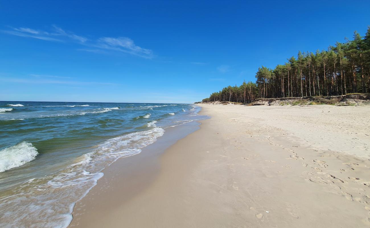 Фото Ulinia Beach с белый чистый песок поверхностью