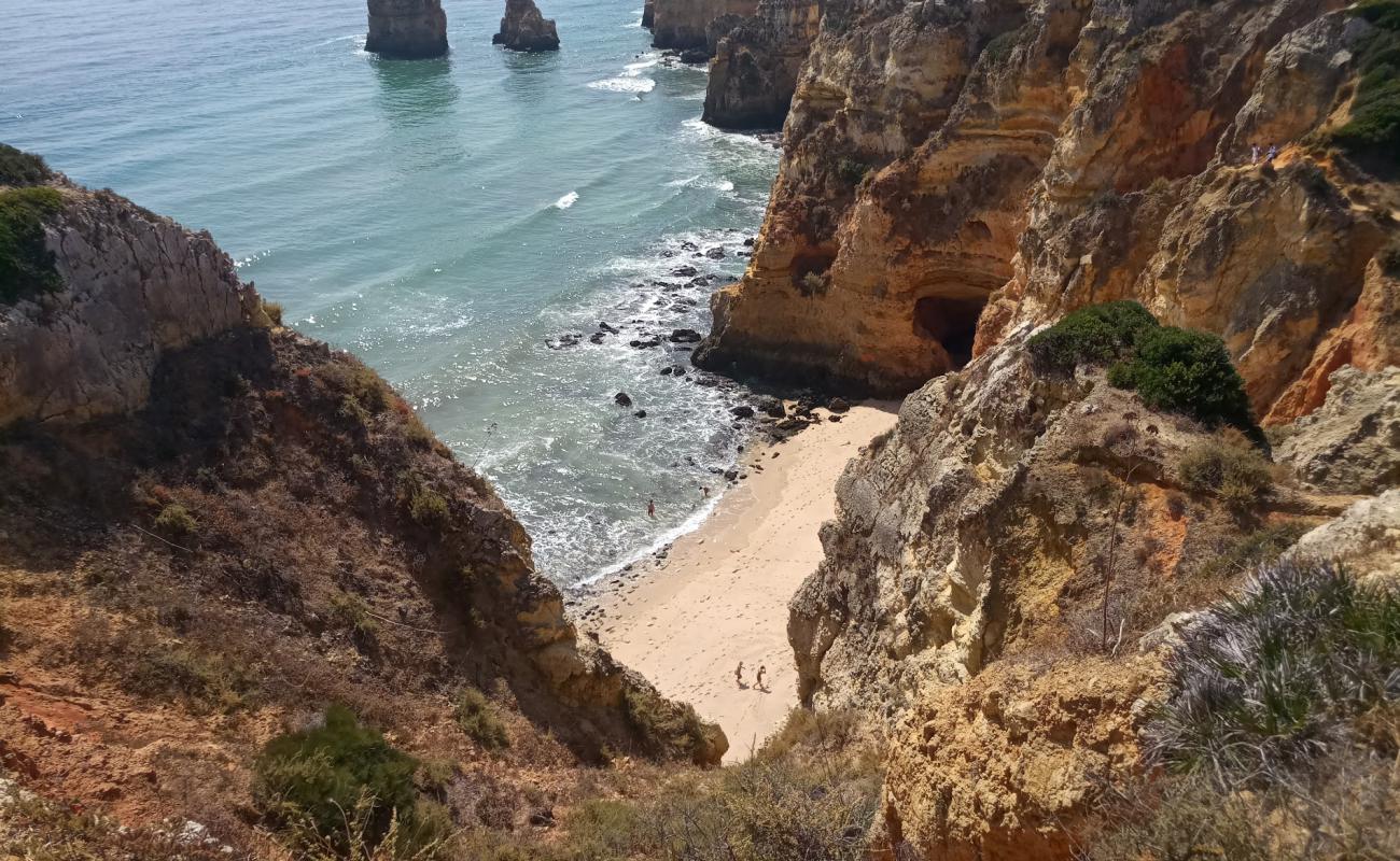 Фото Praia da Balanca с золотистый песок поверхностью