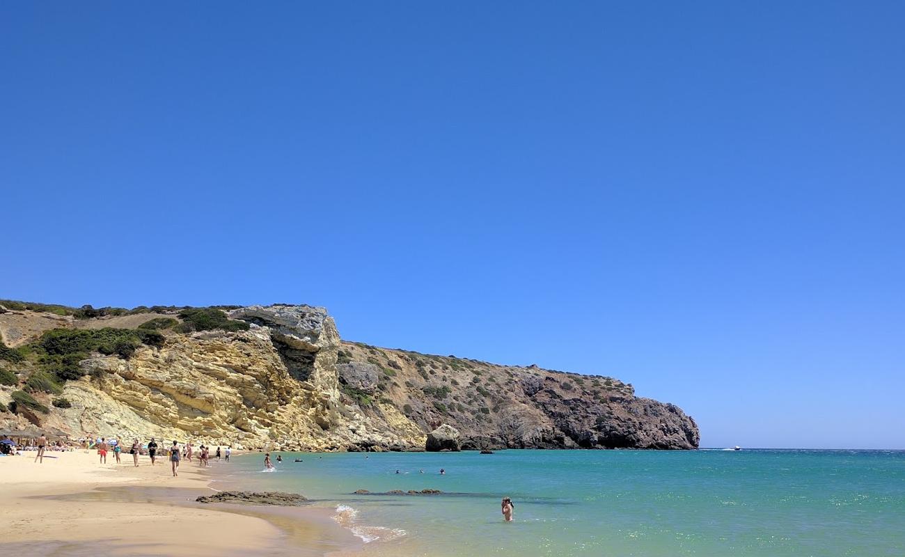 Фото Praia do Zavial с золотистый песок поверхностью