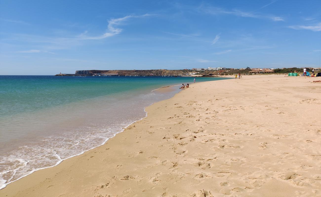 Фото Praia do Martinhal с светлый песок поверхностью