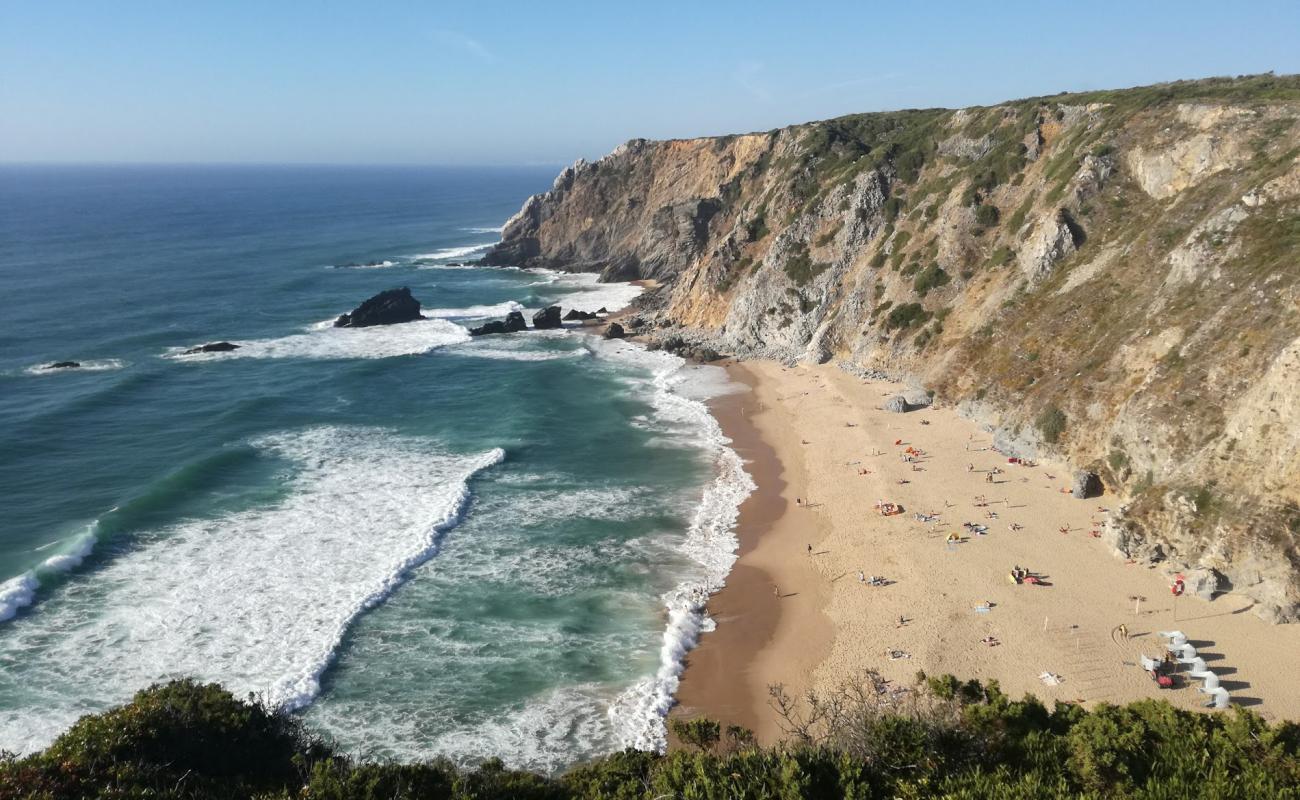 Фото Praia da Adraga с золотистый песок поверхностью