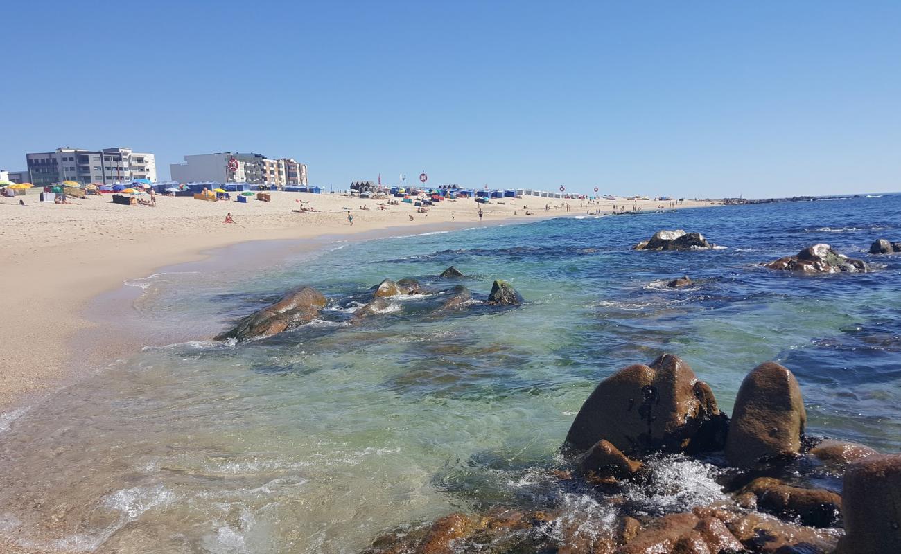 Фото Praia de Coim с светлый песок поверхностью