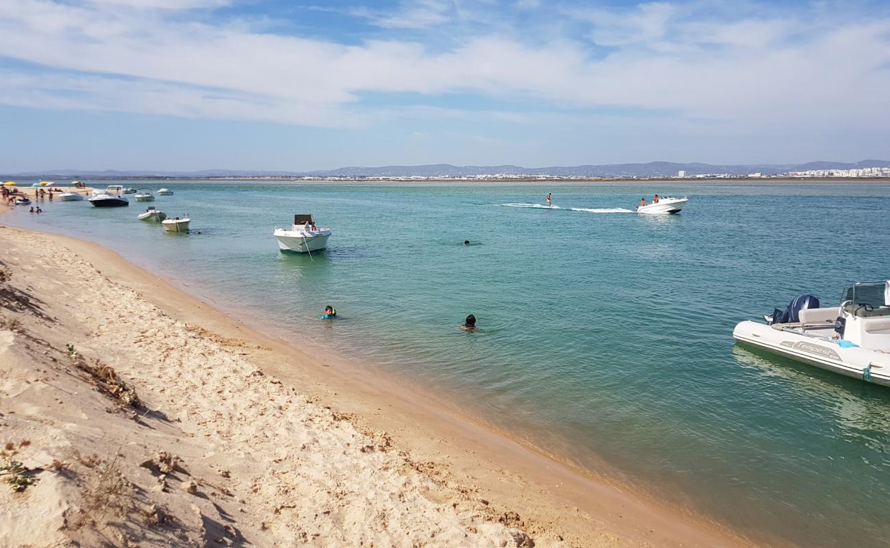 Фото Praia da Barrinha с светлый песок поверхностью