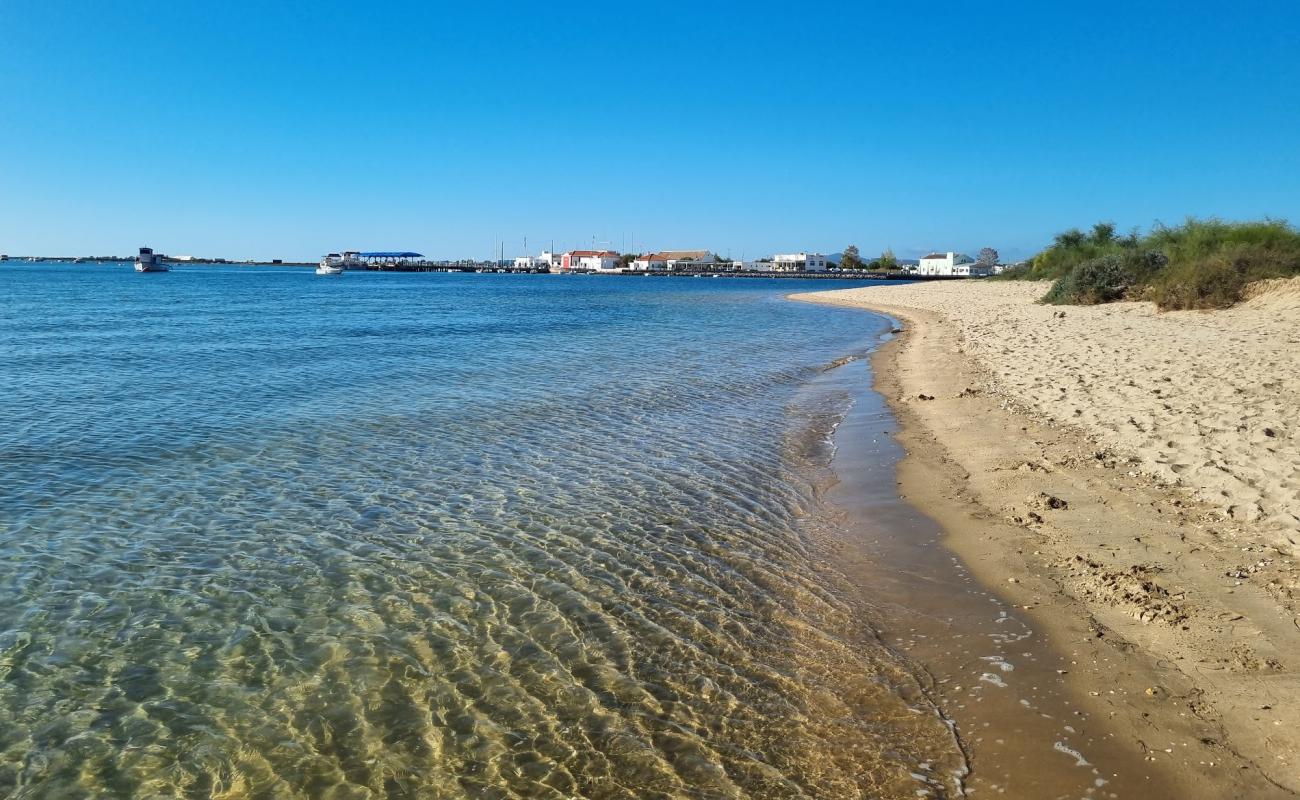 Фото Praia dos Tesos с светлый песок поверхностью