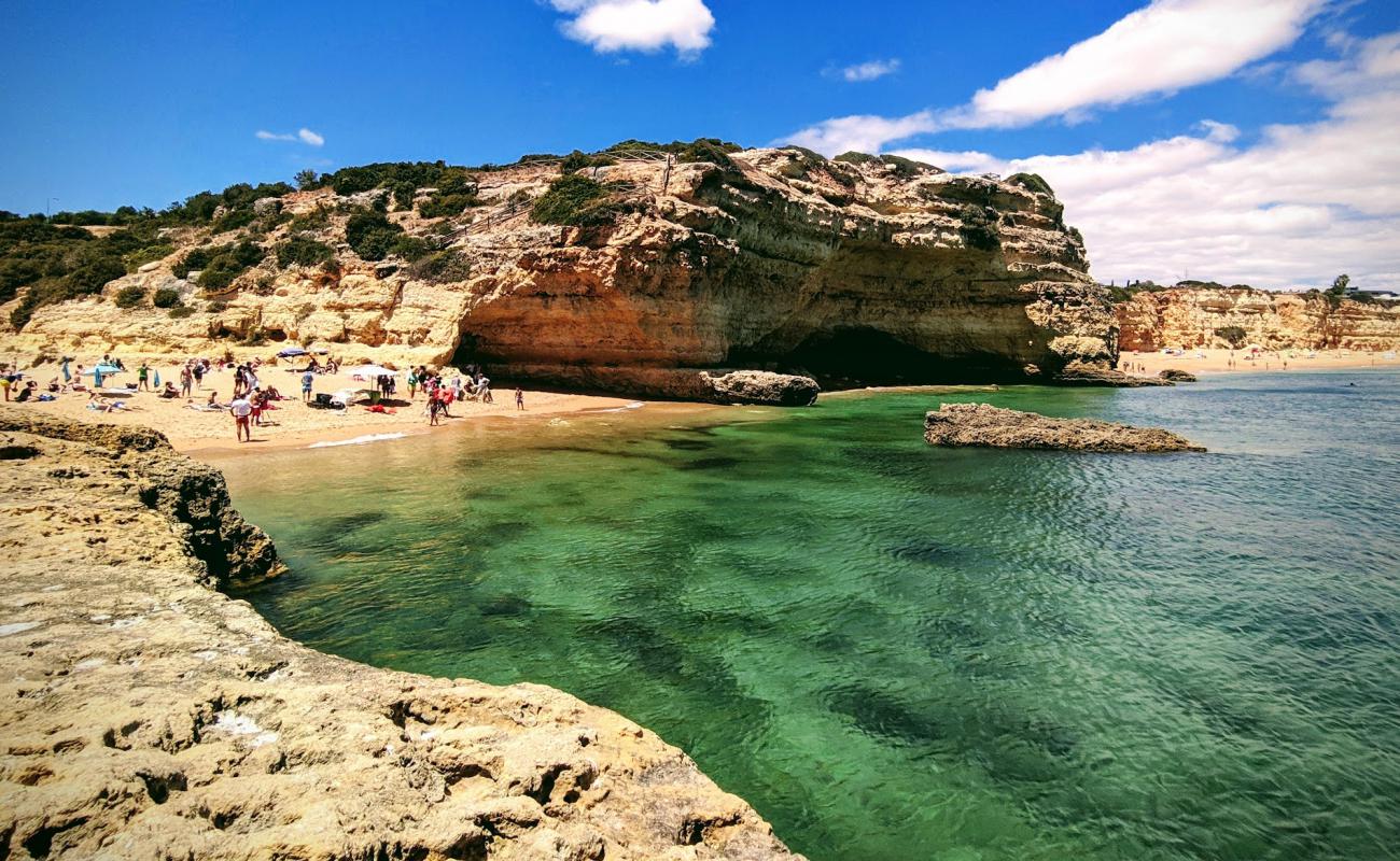 Фото Praia do Barranco с светлый песок поверхностью