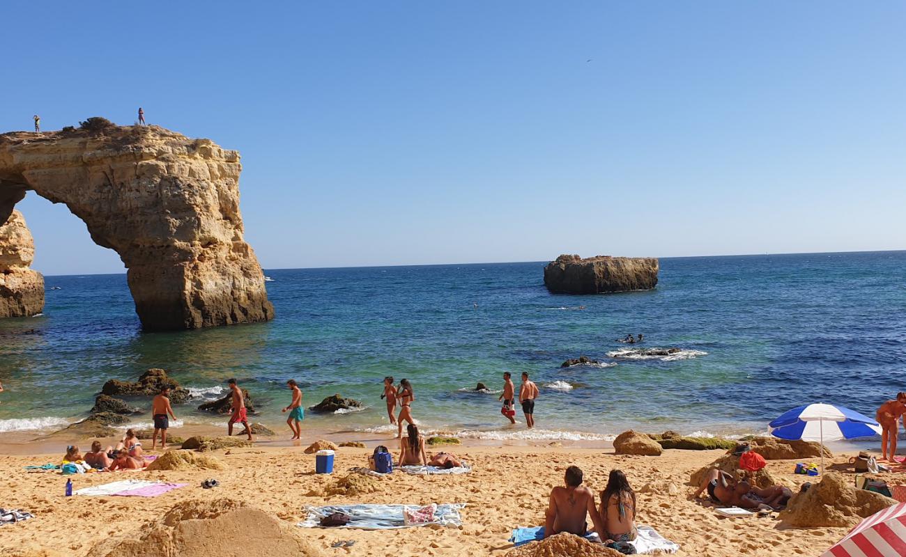 Фото Praia da Estaquinha с светлый песок поверхностью