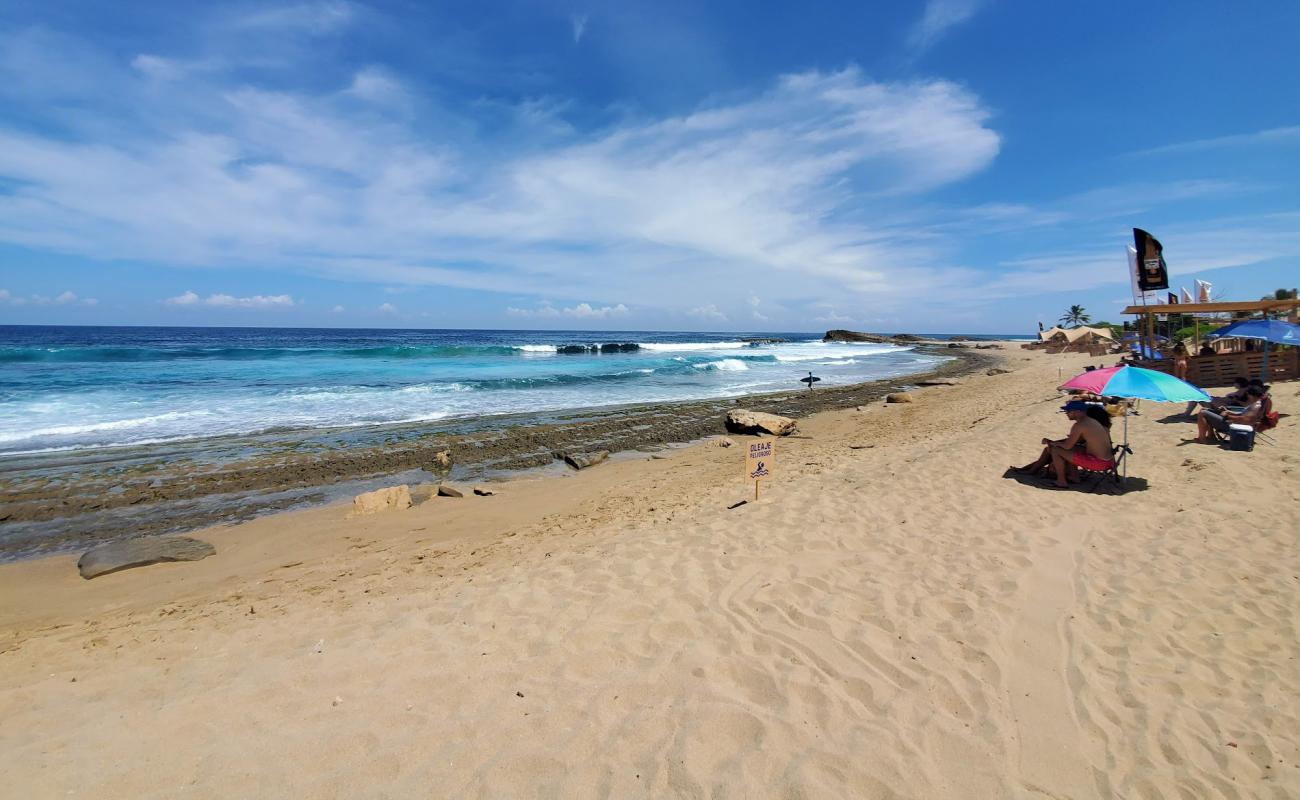 Фото Middles beach с светлый песок поверхностью