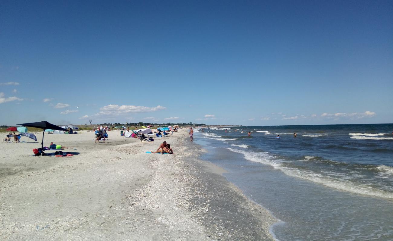 Фото Corbu beach с светлый песок поверхностью