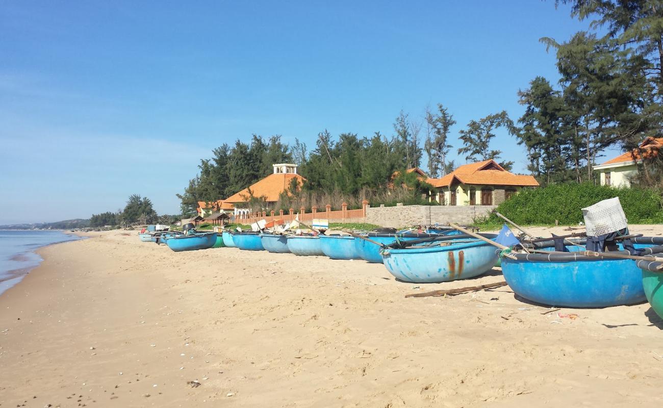 Фото Phan Thiet Beach с светлый песок поверхностью