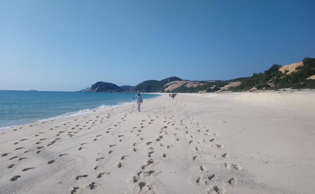 Фото Na Beach с светлый песок поверхностью