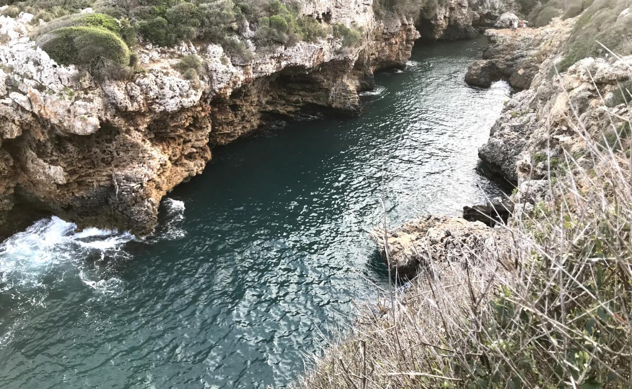 Фото Cala Rafalet с камни поверхностью