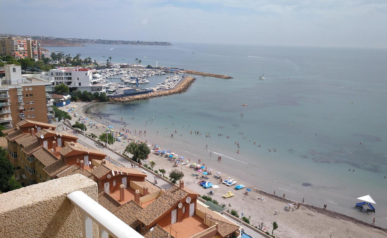 Фото Playa de Campoamor с светлый песок поверхностью