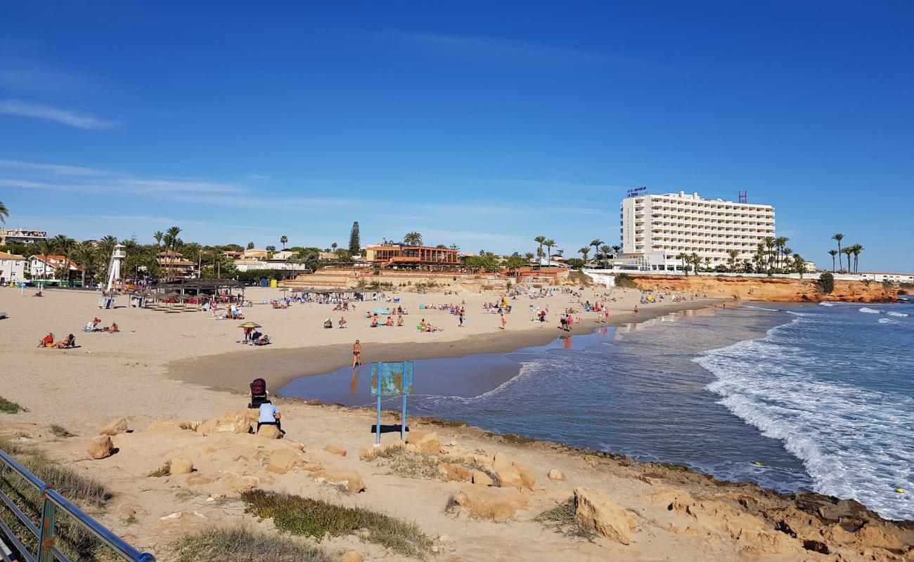 Фото Playa la Zenia с темный песок поверхностью