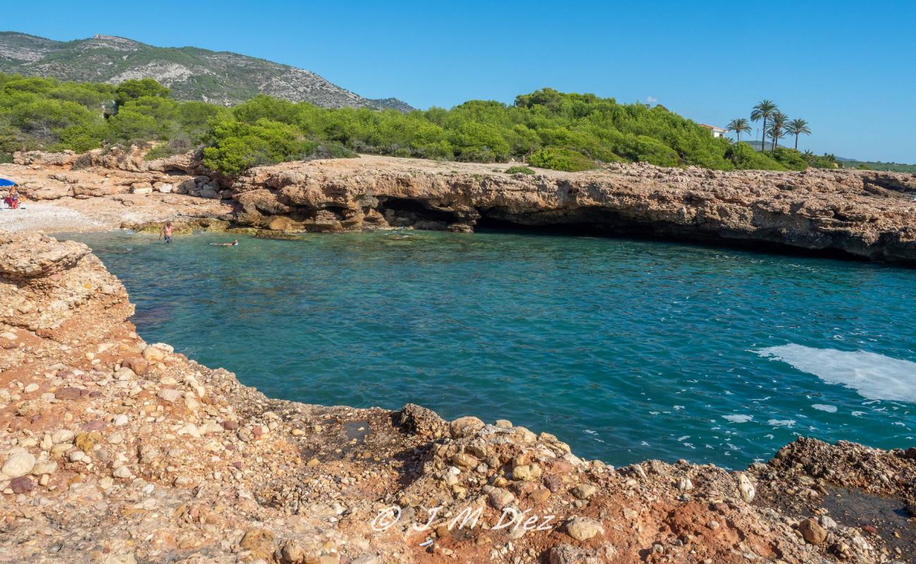 Фото Cala Mundina с серая галька поверхностью