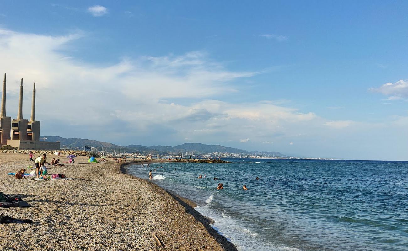 Фото Platja del Forum с темный ракушечник поверхностью