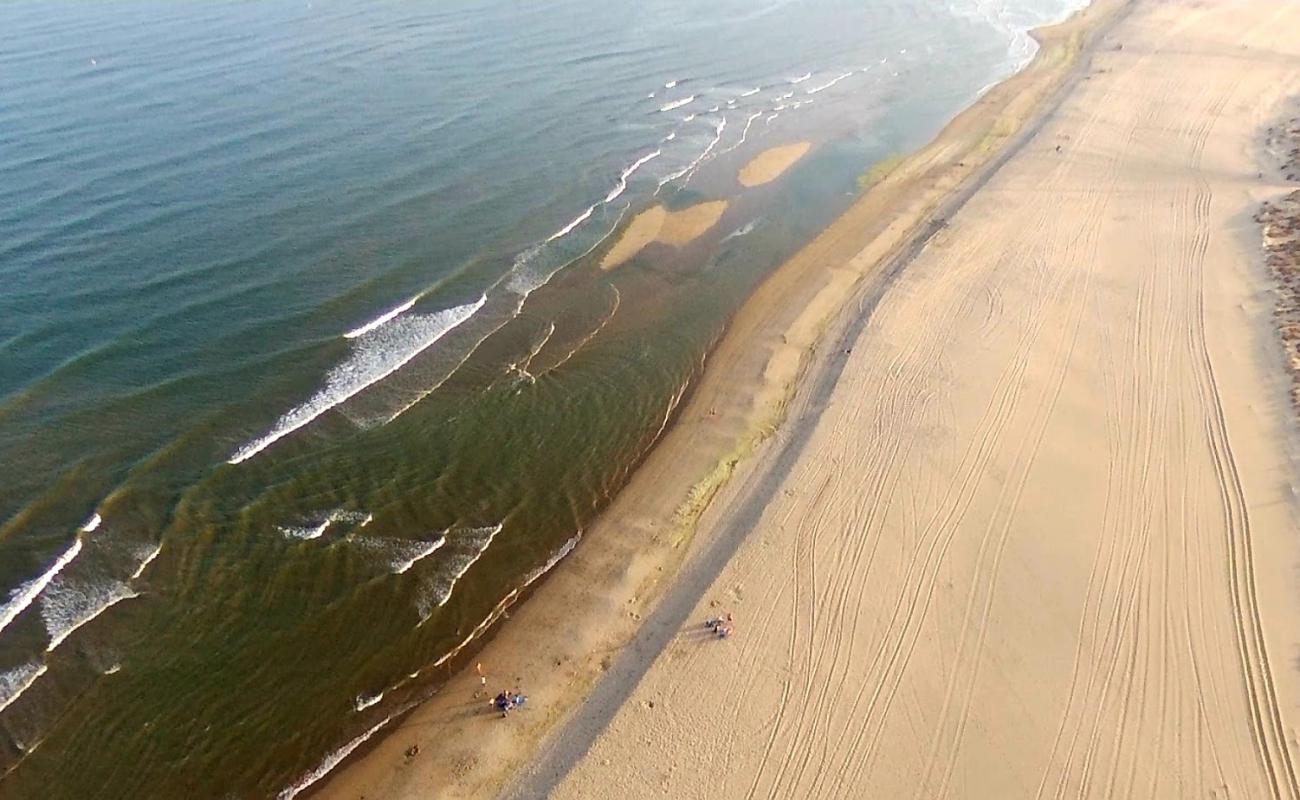 Фото Playa de los Haraganes с светлый песок поверхностью