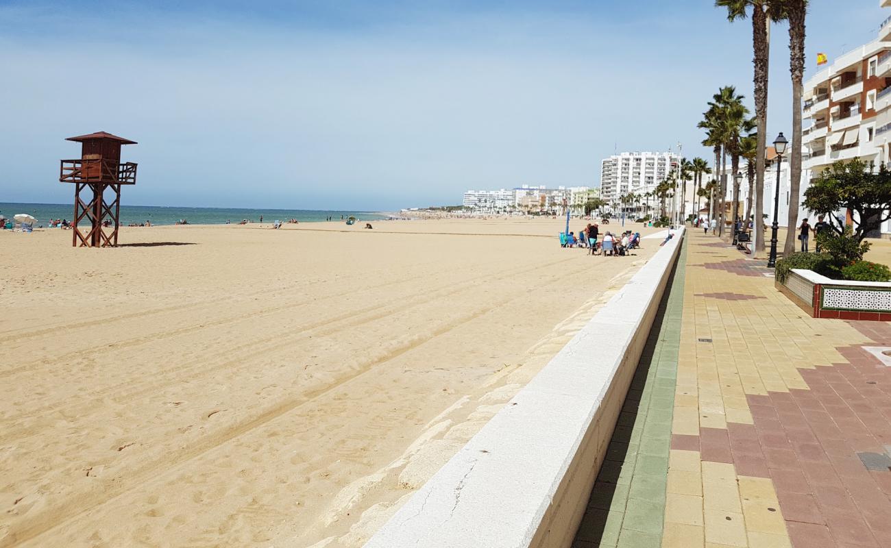 Фото Playa de la Costilla с золотистый песок поверхностью