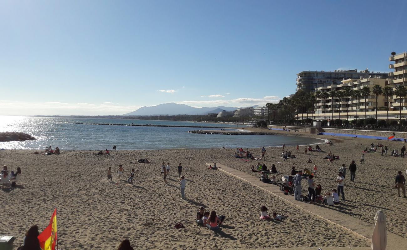 Фото Playa del Faro с серый песок поверхностью