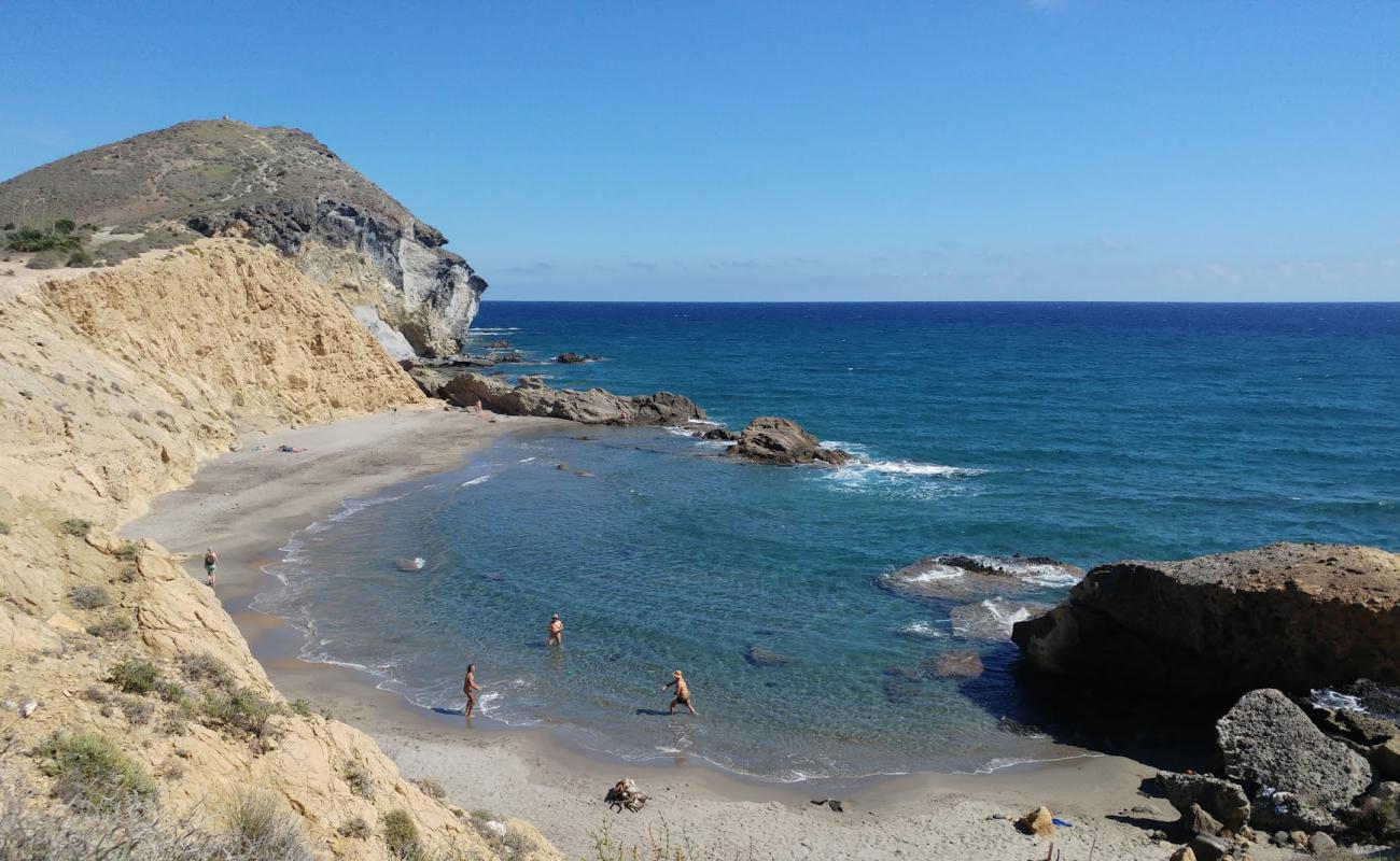 Фото Cala de los Amarillos с серый песок поверхностью