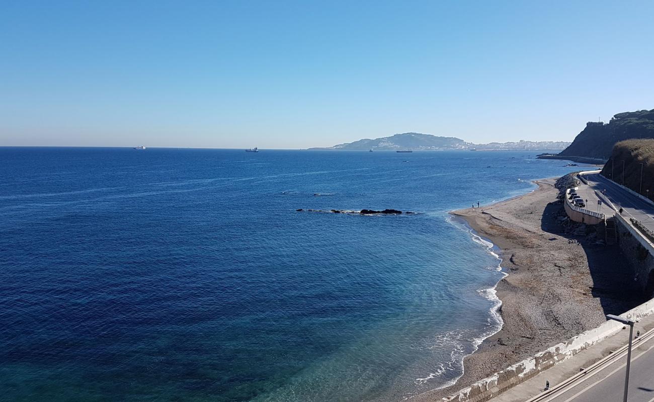 Фото Playa Calamocarro с светлая галька поверхностью