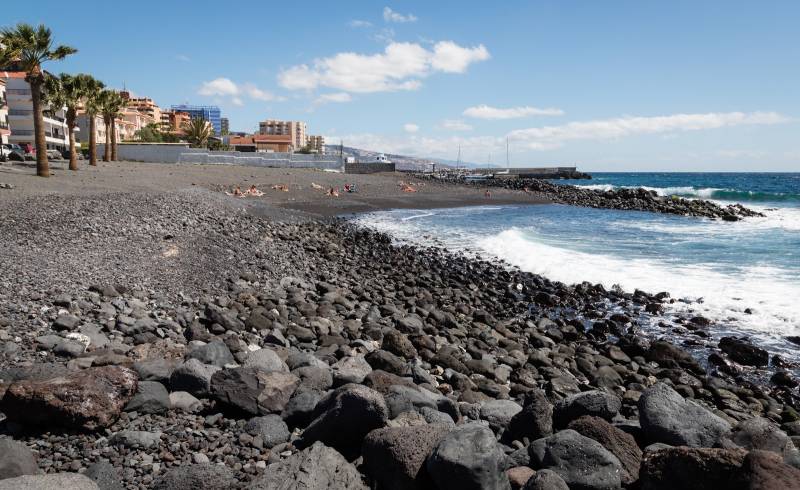 Фото Playa de Olegario с песок с камнями поверхностью