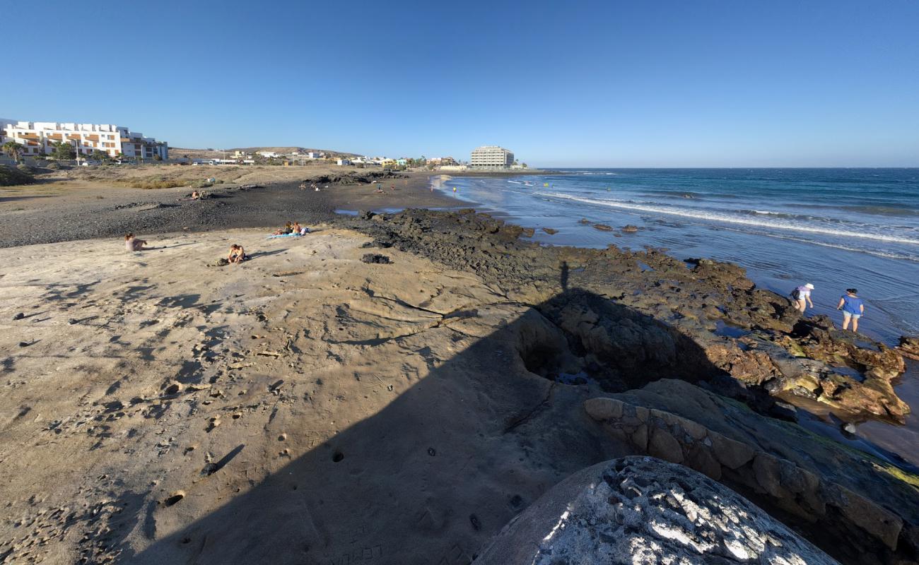 Фото Playa El Salado с серый песок поверхностью