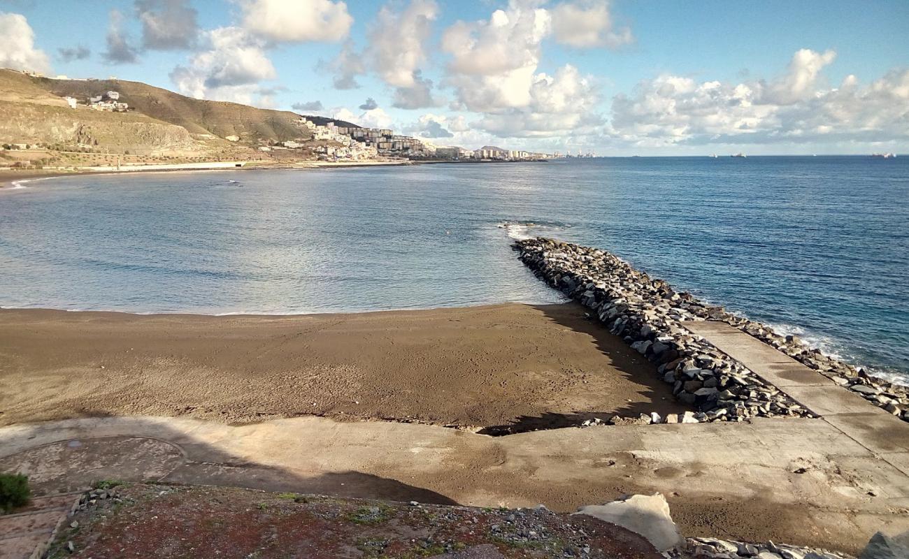 Фото Playa De La Laja с серый песок поверхностью