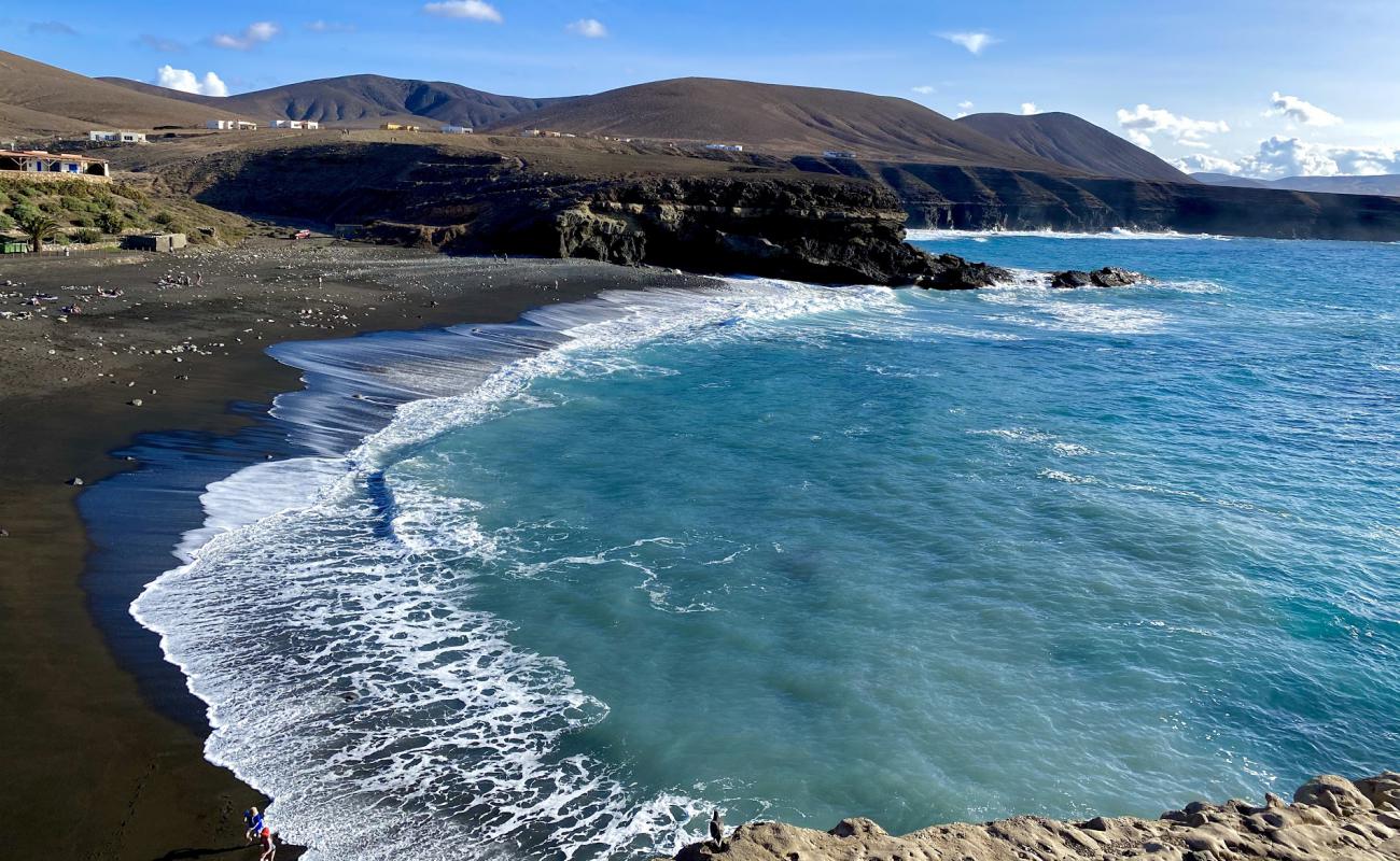 Фото Playa de Ajui с серый песок поверхностью