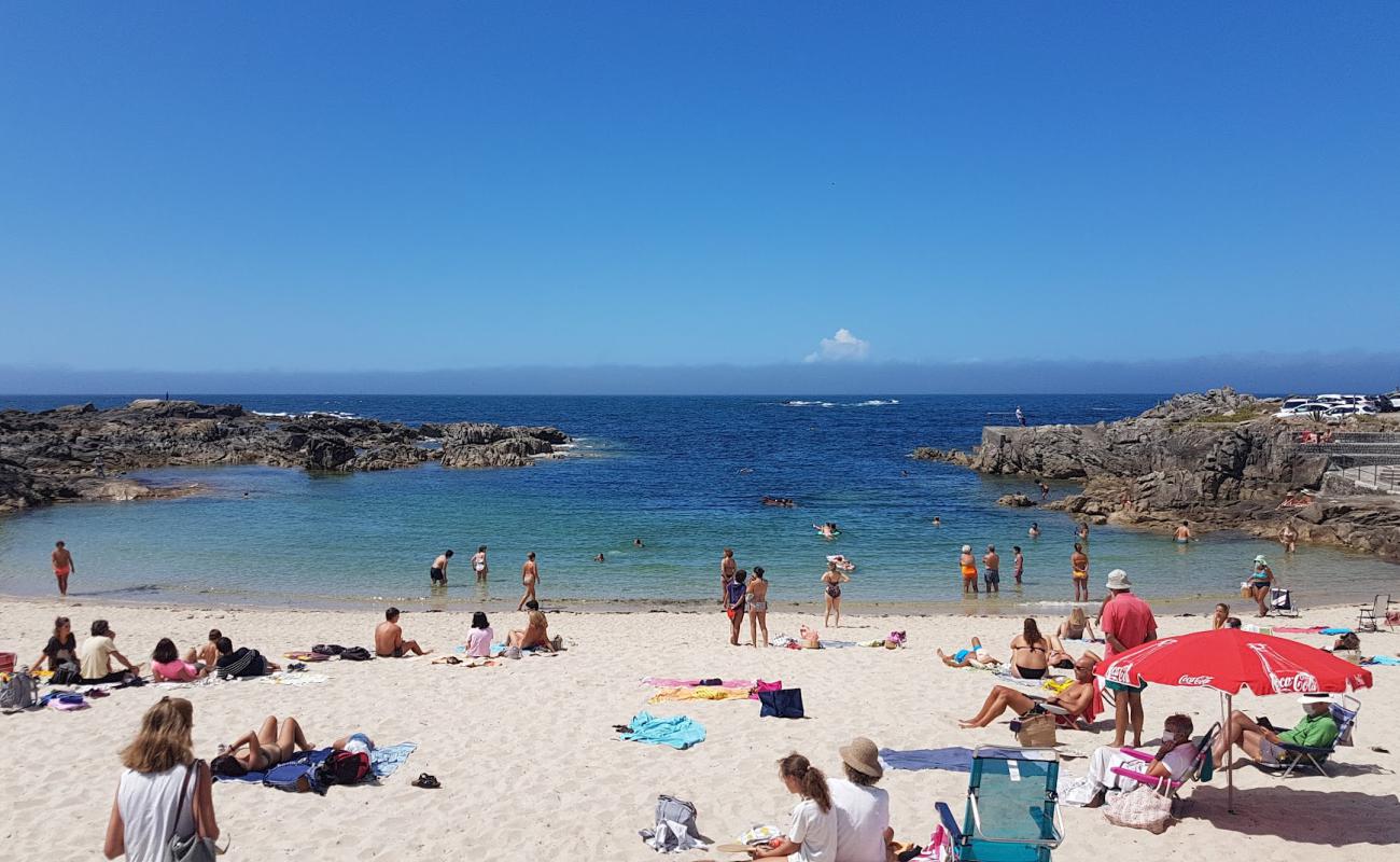 Фото Praia de Fedorento с белый песок поверхностью