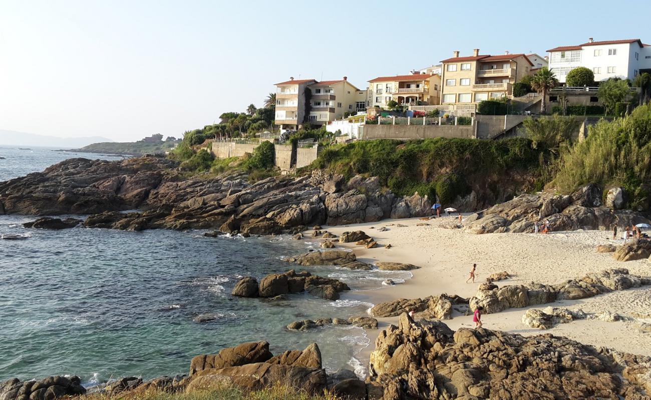 Фото Playa de Fortinon с белый песок поверхностью