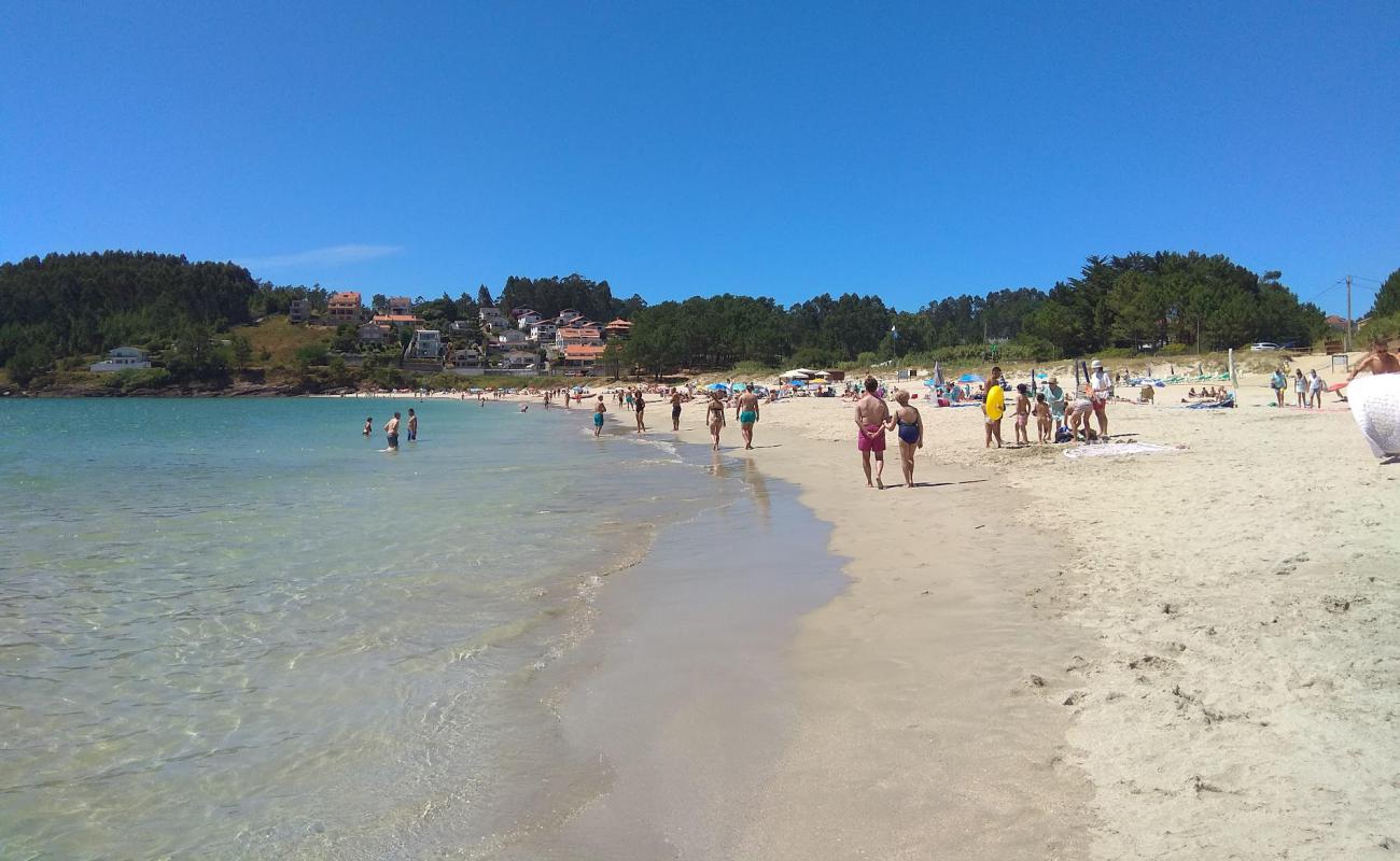 Фото Canelas beach с белый чистый песок поверхностью