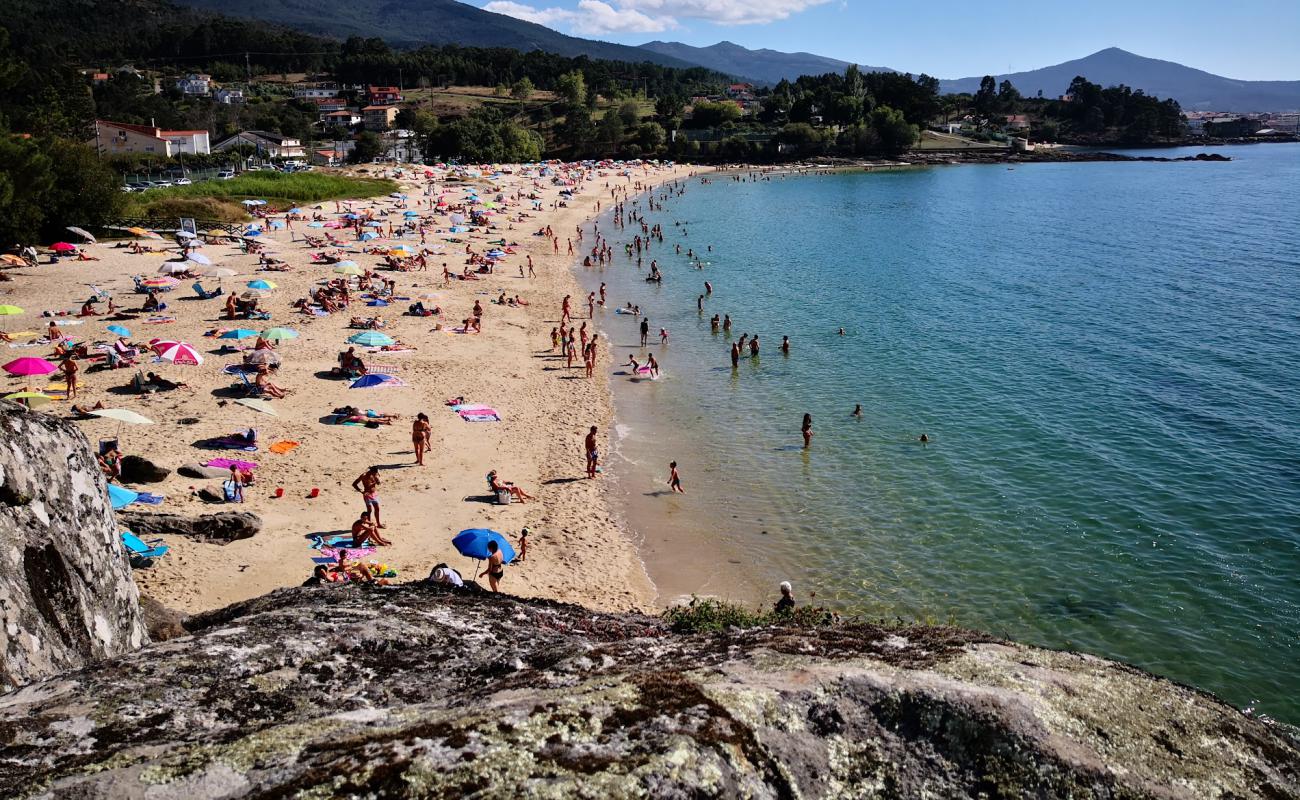 Фото Hornanda beach с белый чистый песок поверхностью