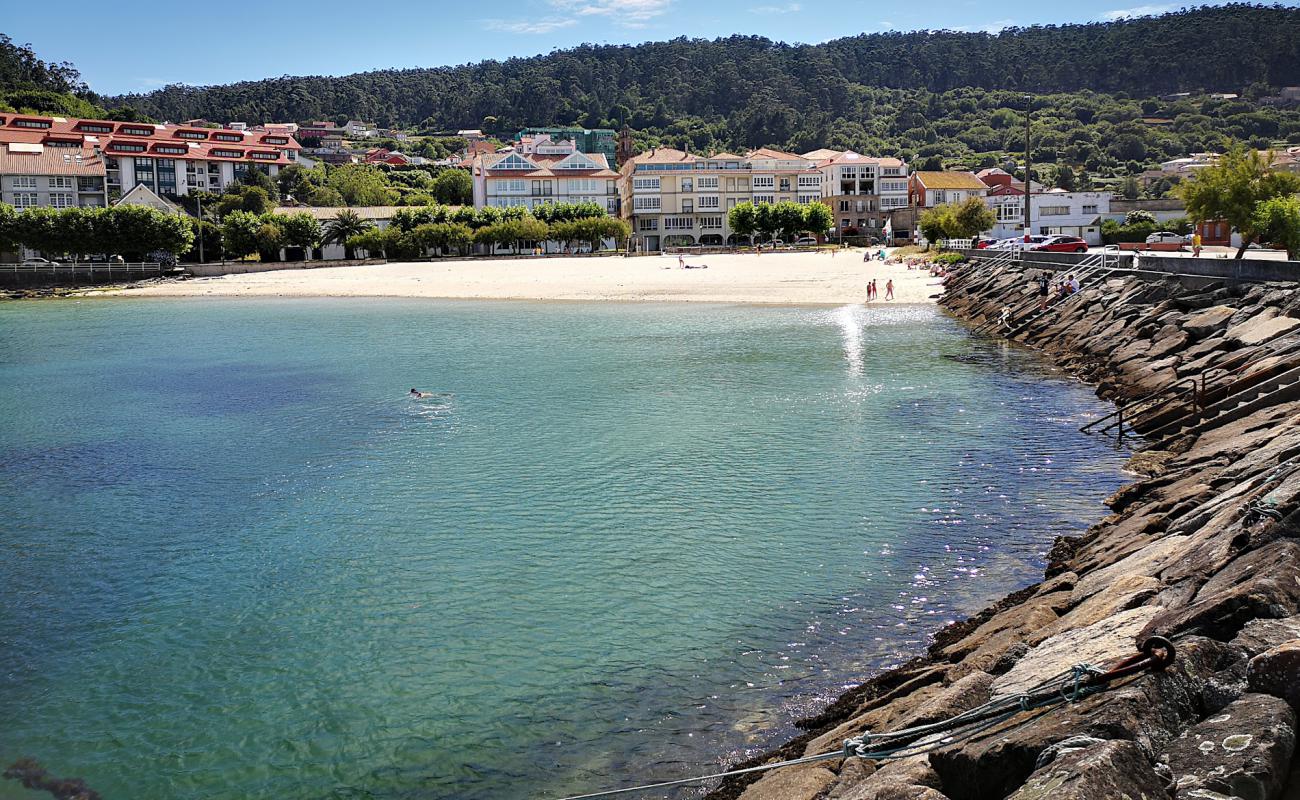 Фото Praia do Castelo с белый песок поверхностью