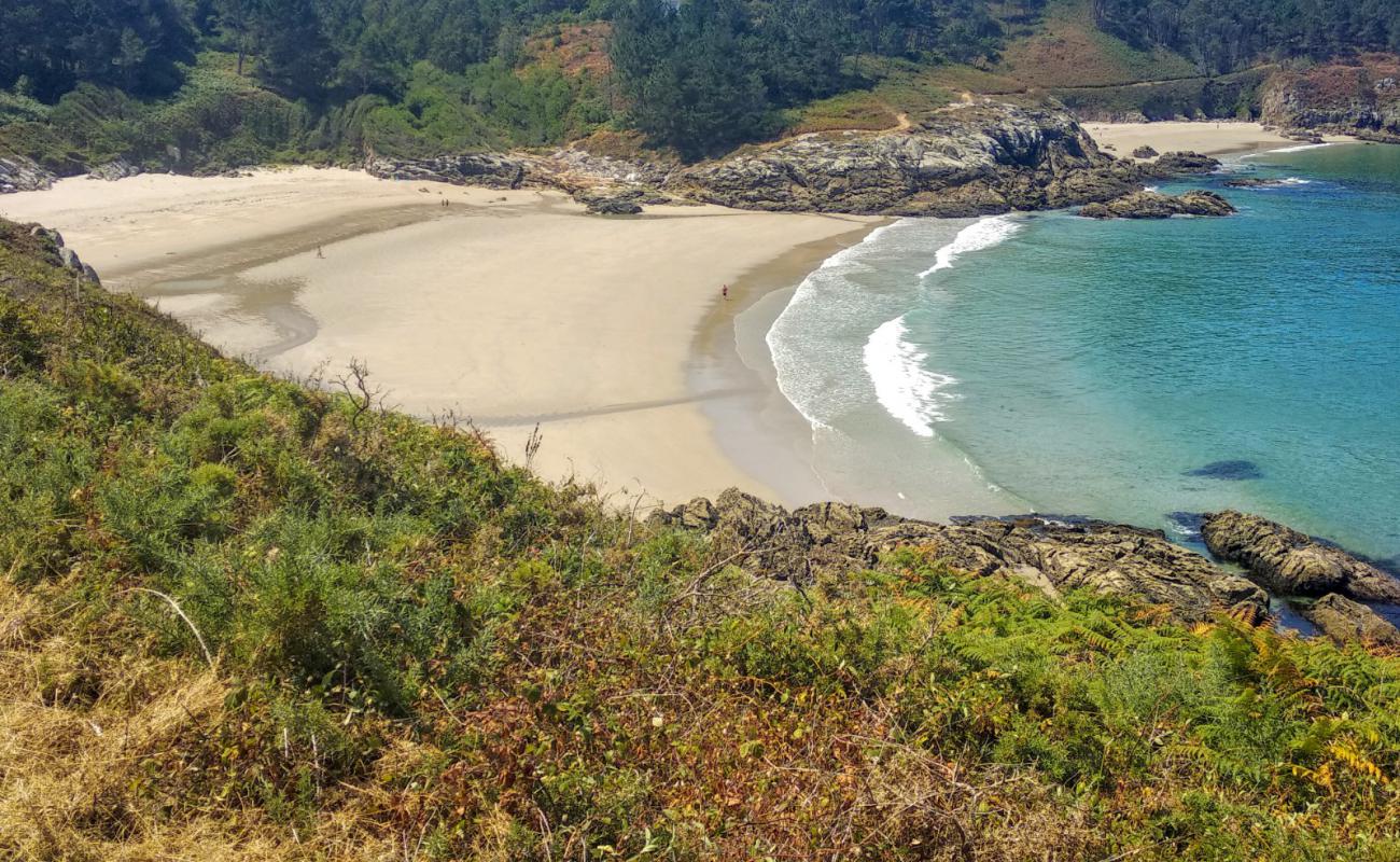 Фото Praia de Rebordelo с белый песок поверхностью