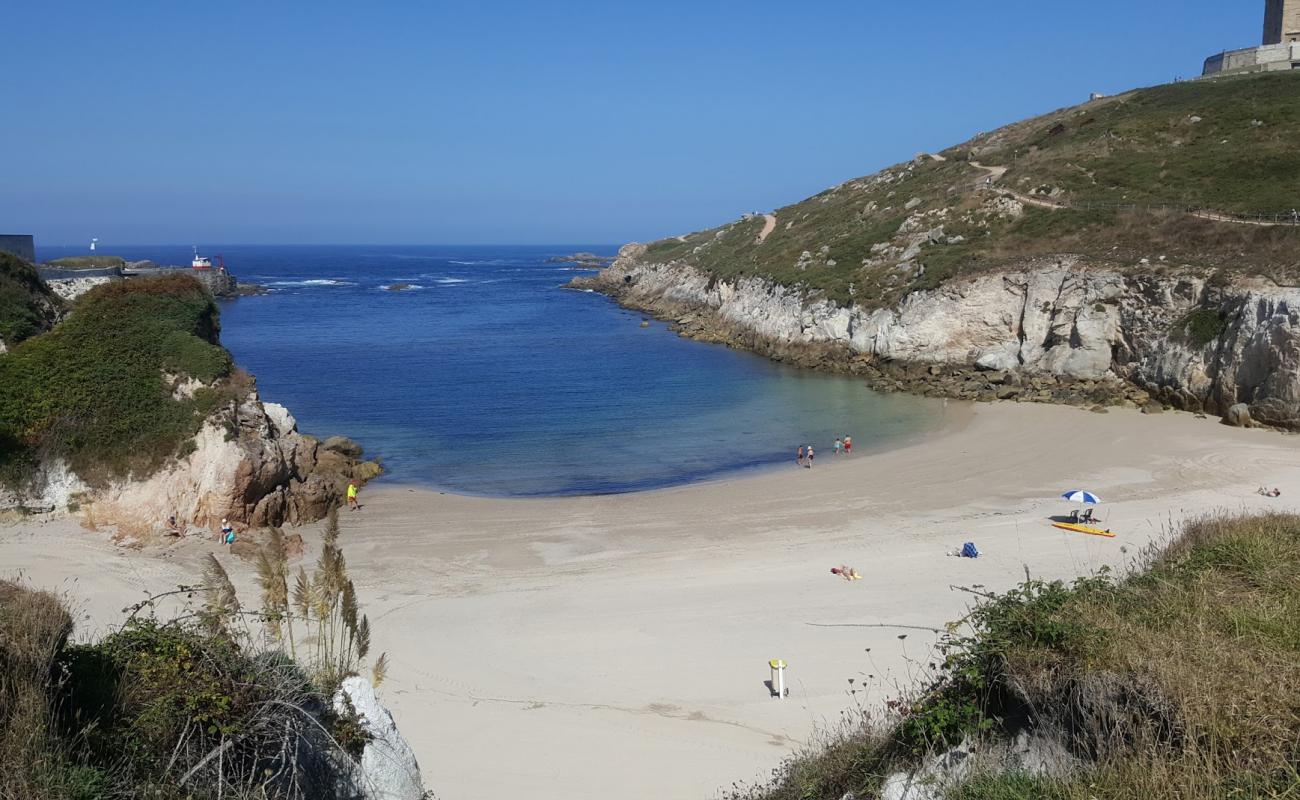 Фото Praia de Adormideiras II с белый чистый песок поверхностью