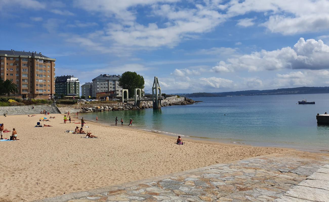 Фото Praia de Adormideiras с белый песок поверхностью