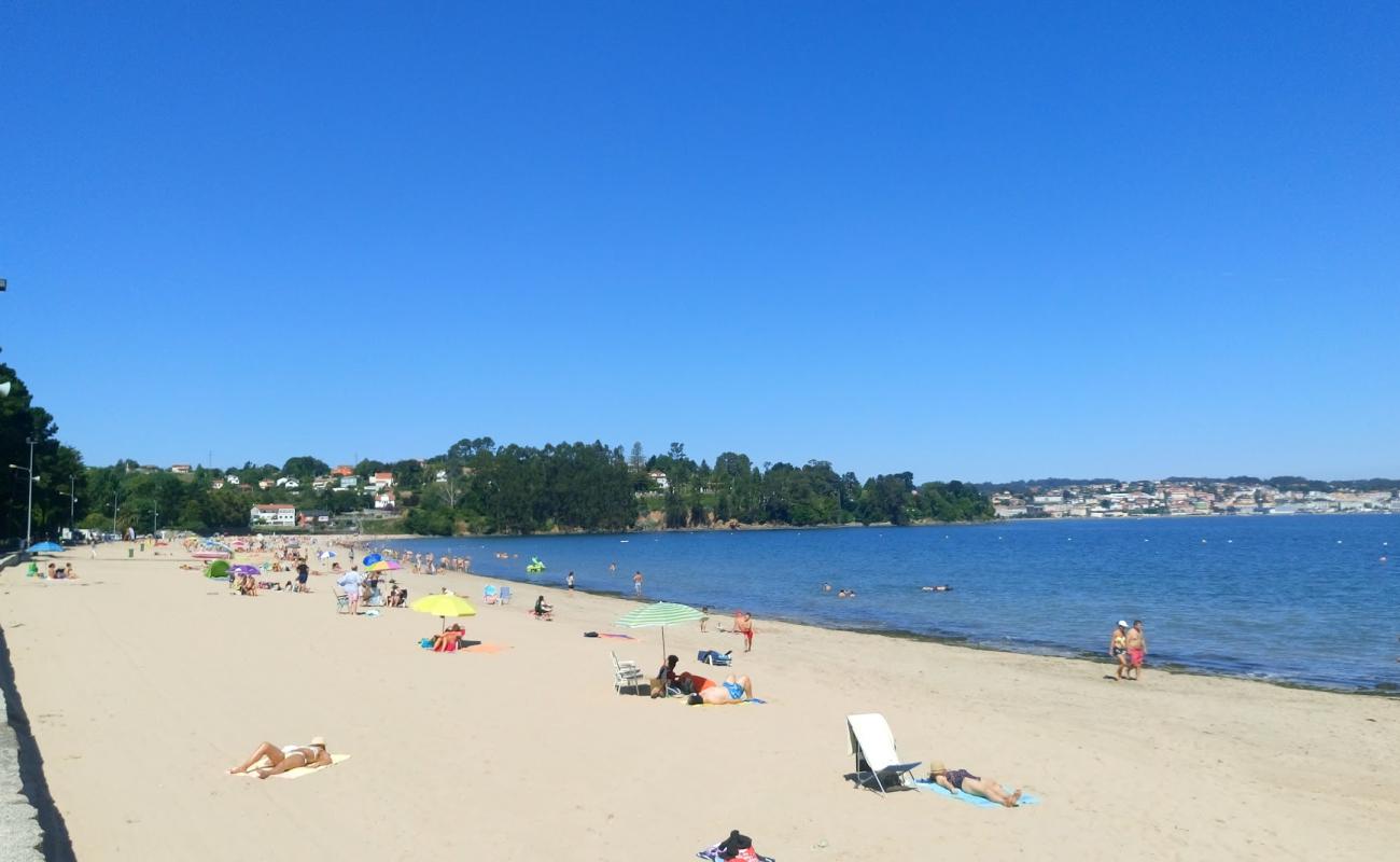 Фото Playa Gandario с белый песок поверхностью