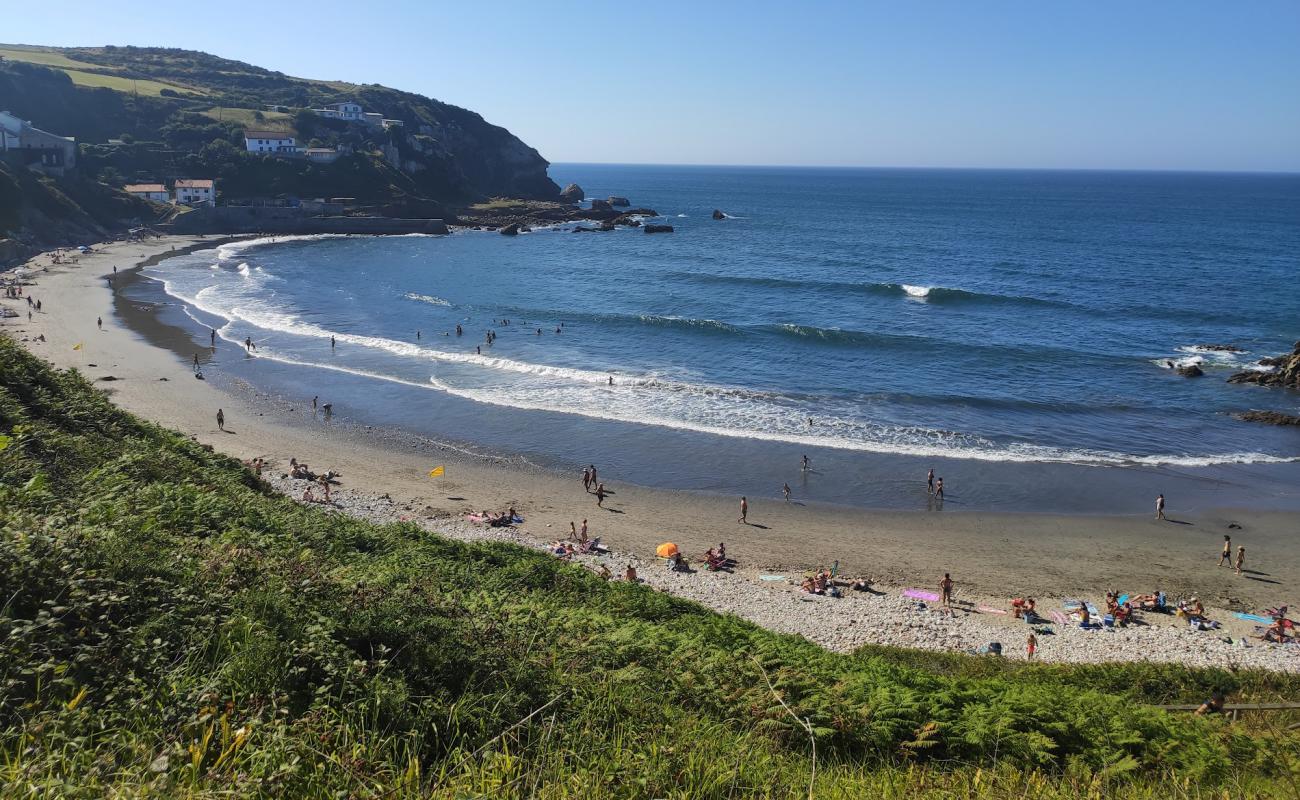 Фото Playa de Arnao с светлая галька поверхностью