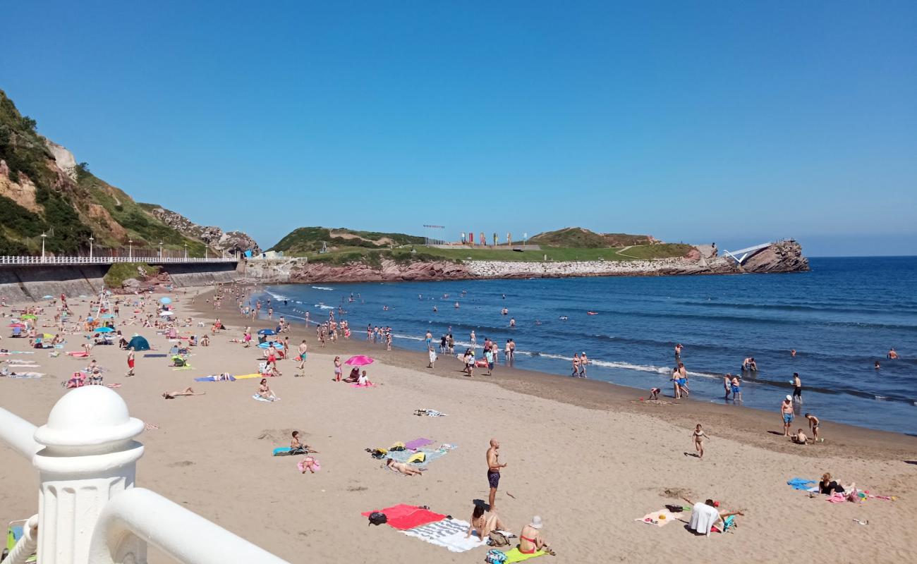 Фото Playa de Salinas с светлый песок поверхностью