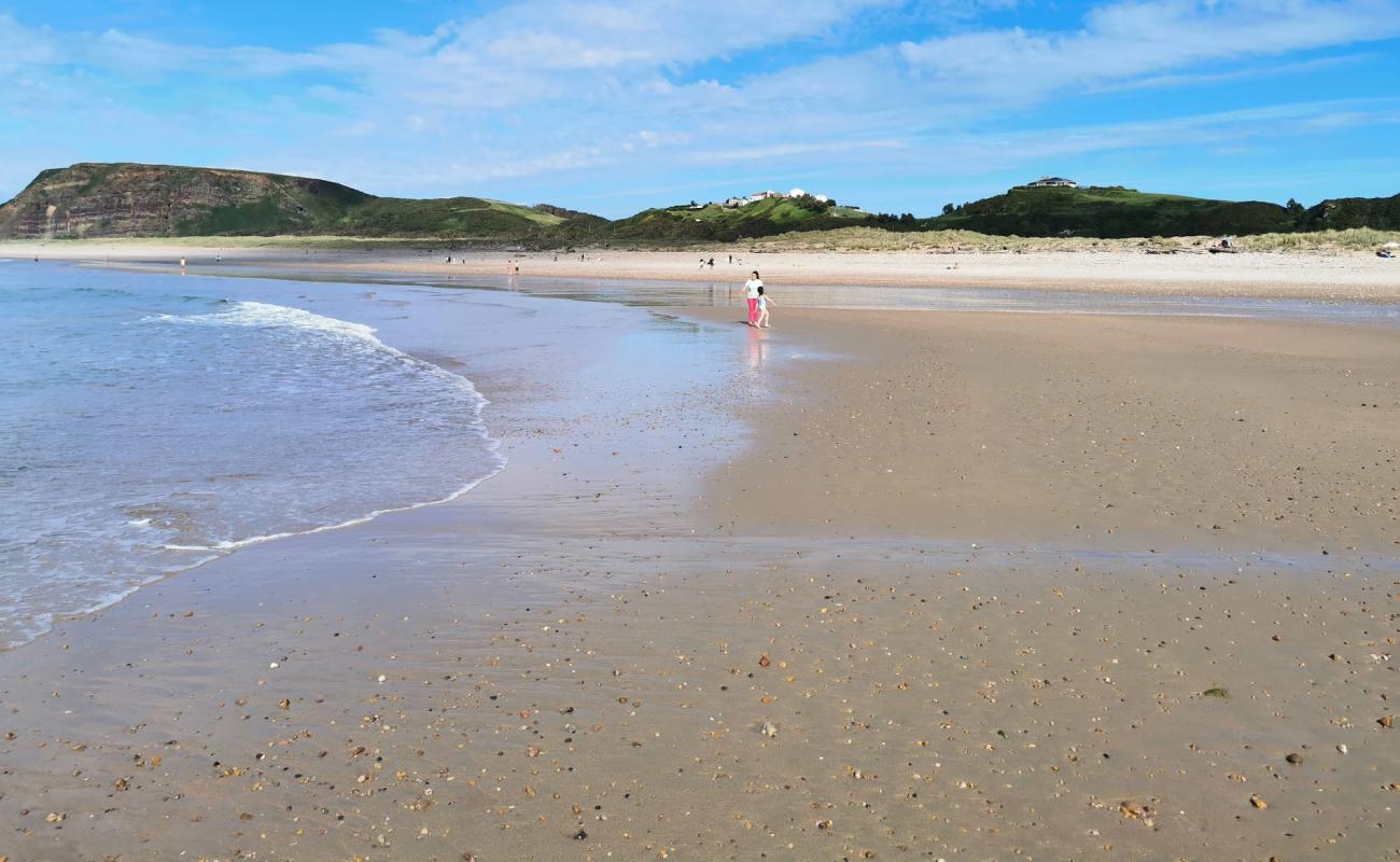 Фото Playa de Xago с светлый песок поверхностью