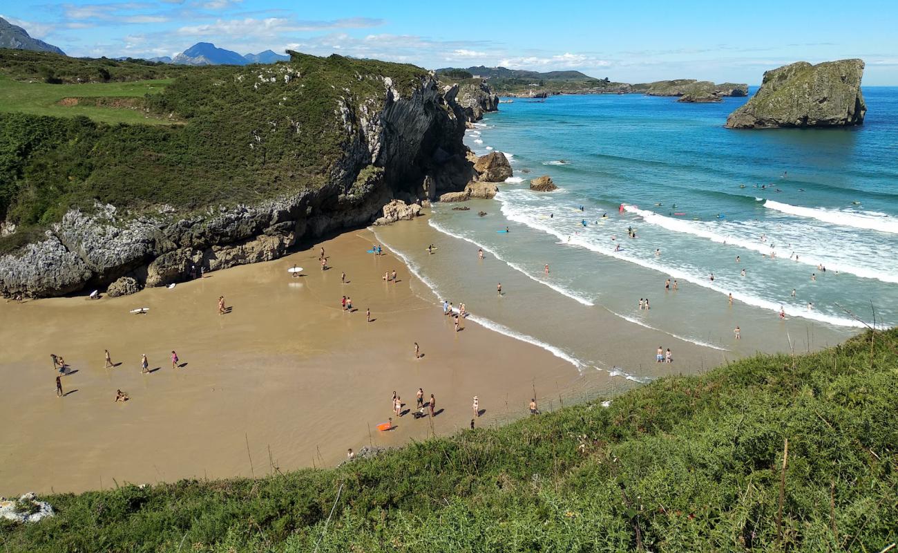 Фото Playa el Portillu с светлый песок поверхностью