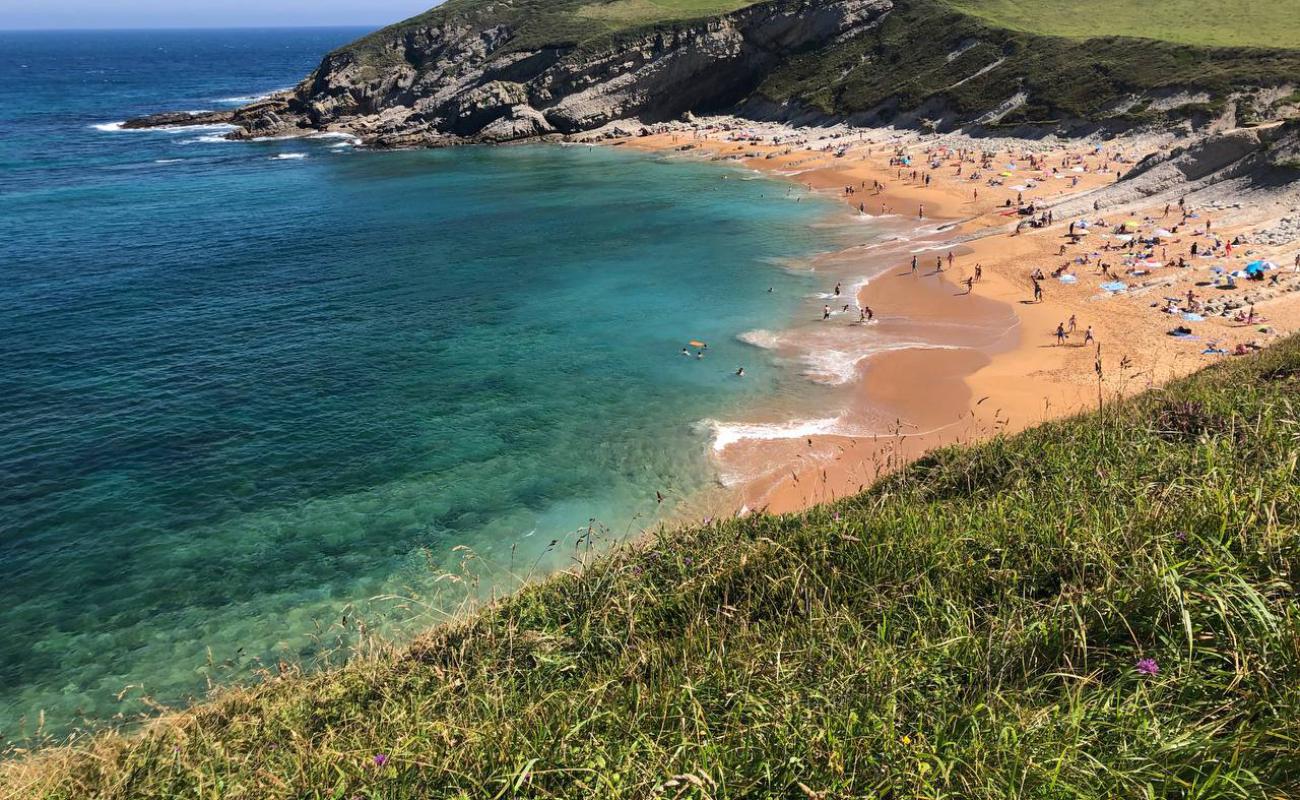 Фото Playa de Tagle с светлый песок поверхностью