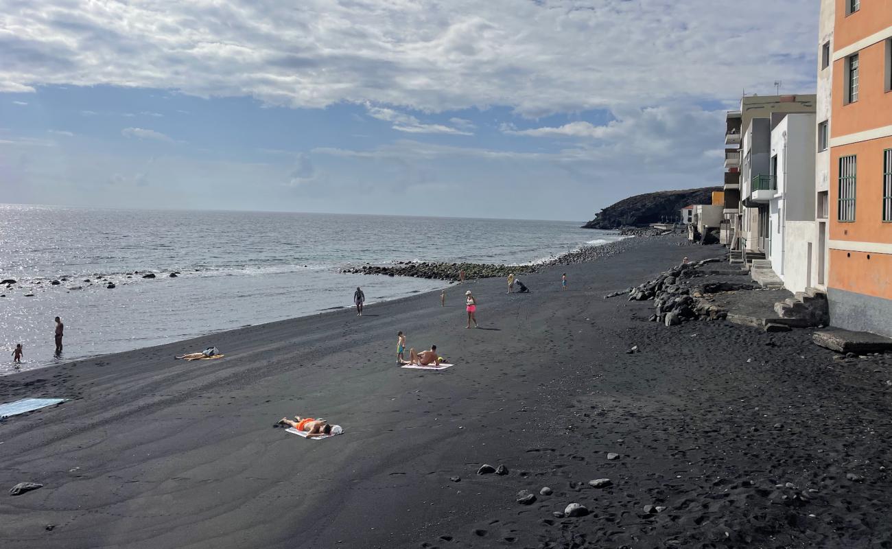 Фото Playa Candelaria с песок с камнями поверхностью